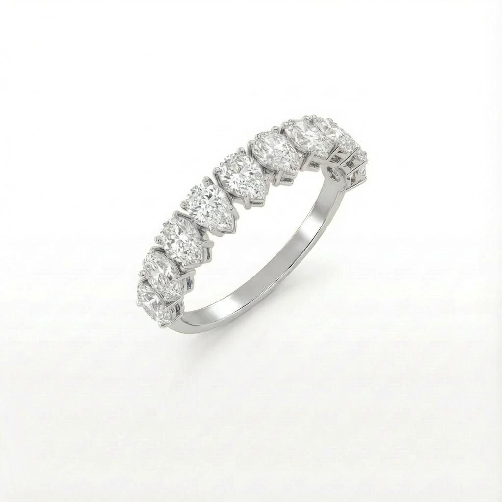 Pear half eternity ring