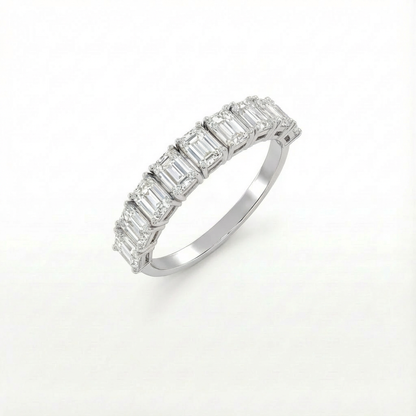 Emerald half eternity ring