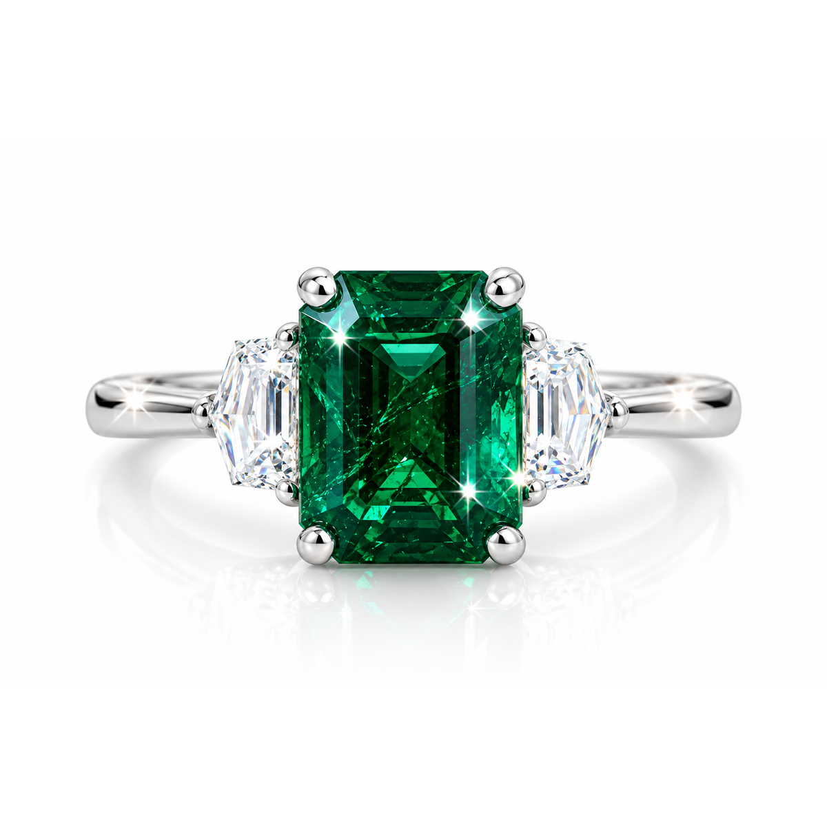 emerald cut emerald ring with trapezoid diamonds