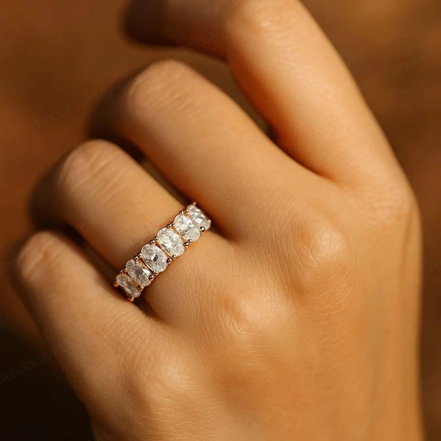 Oval half eternity ring