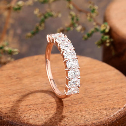 Emerald half eternity ring